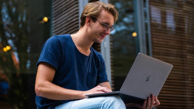 Student Working With Laptop